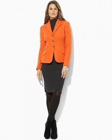 Designed in sophisticated wool tweed, this smartly tailored jacket is an elegant representation of chic, modern style.