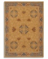 Porcelain blues blend with cinnabar browns on this exquisite Karastan rug. Framed in unique fretwork designs, the Mandarin area rug displays a saffron yellow field, speckled with Chinese medallions and stylized bat motifs. Woven from worsted New Zealand wool and luster-washed for extra sheen.