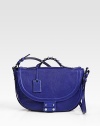 Vibrant leather in a contoured flap-front design offset by polished silver-tone hardware.Top handle, 1¾ dropRemovable adjustable shoulder strap, 13-14 dropFlap-snap closureProtective metal feetCenter zip compartmentOne inside zip pocketFully lined10W X 8H X 2½DImported