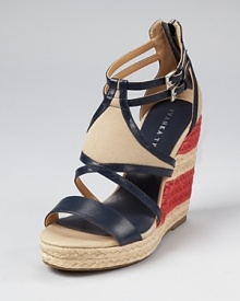 Americana inspired, the IVANKA TRUMP Keira wedge shines in patriotic hues. A striped wedge solidifies the tried-and-true shoe.