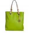 Sophisticated with simple, clean lines, MICHAEL Michael Kors textured leather tote is an elegant and versatile choice - Natural flat double top handles with buckle detail at base, metal logo on front, logo charm attached to handle, inside zippered back wall pocket, front wall slot pocket, cinch strap, strap with clip attached for keys - The perfect choice for work, school or running errands
