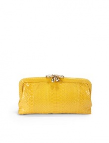 THE LOOKFrame top envelope silhouetteMagnetic crystal-accented bow clasp closureOne inside open pocketInside logo detailTHE MEASUREMENT10½W X 5H X 2DTHE MATERIALSwarovski crystalsPythonSilk liningORIGINHandmade in the USA