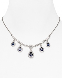 As if taken from a socialite's jewel box, this ornate drop necklace from Carolee flaunts an heirloom quality cast in rhodium plated metal with delicate dangling crystal stations.