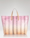 Carlos Falchi's ombre snake tote is a first class ravel companion. Complete with a matching business card holder and passport cover, the colorful carryall tips the scales on jet setting chic.