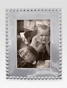 Highly polished and richly dimensional, this elegant frame is hand-crafted of recycled aluminum.Recycled aluminumWipe cleanImported Highly polished and richly dimensional, this elegant frame is hand-crafted of recycled aluminum.Recycled aluminumWipe cleanImported