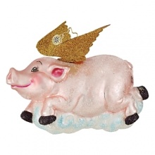 A happy pig with gold glittering wings flies over a puffy cloud. A happy pig with gold glittering wings flies over a puffy cloud.