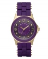 A passion for purple and fashion, by Marc by Marc Jacobs. Watch features purple silicone-wrapped stainless steel bracelet with gold ion-plated accents. Round gold ion-plated case with concave ring. Purple dial features logo, goldtone hands, numerals at twelve, three, six and nine o'clock and gold ion-plated dot markers. Quartz movement. Water resistant to 30 meters. Two-year limited warranty.