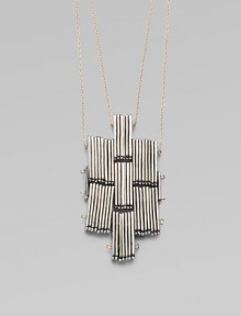 Sculpture to wear, this distinctive cross-shaped pendant is formed of elongated silvertone beads with golden accents for a striking effect.Silvertone and goldtoneLength, about 30Slip-on stylingMade in USA Sculpture to wear, this distinctive cross-shaped pendant is formed of elongated silvertone beads with golden accents for a striking effect.Silvertone and goldtoneLength, about 30Slip-on stylingMade in USA