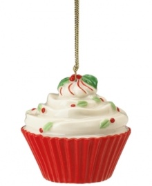 Treat yourself. Sprinkled with holly, the Lenox Christmas Cupcake ornament makes decorating the tree that much sweeter.