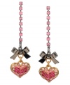 Flirty and feminine. Betsey Johnson's sweet style features pink crystal coated hearts and hematite bows strung from intricate, pink crystal cup chains. Set in gold tone mixed metal. Approximate drop: 2-1/4 inches.