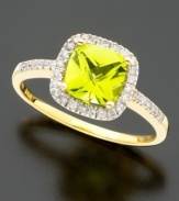 A flash of brilliance. Stunning cushion-cut peridot (1-1/3 ct. t.w.) surrounded by round-cut diamonds (1/5 ct. t.w.) creates a sensational style. Set in 14k gold.