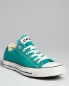 Classic Converse All Star sneakers are especially of-the-moment in the season's ultra-trendy jewel tones.