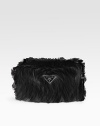 Lush faux fur makes this slim bag an instant statement-maker.Wristlet strap, 5½-6 drop Top zip closure Signature jacquard lining 11W X 7H X 3½D Made in Italy