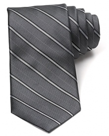 An immaculate silk tie with a classic pinstripe pattern from Michael Kors brings a bit of panache to your office attire. An immaculate silk tie with a classic pinstripe pattern from Michael Kors brings a bit of panache to your office attire.