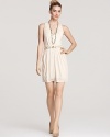 Akiko's V-neck dress is a chic choice for summer. A hardware-bedecked elastic belt finishes the look with striking style.