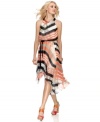 Jessica Simpson's dress is prepped for spring occasions with a striped print highlighted by a pop of peachy hue. The braided belt gives it a blouson-style fit at the bodice that's totally on-trend for the season.