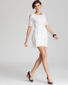 Evoke demure femininity in this Patterson J. Kincaid dress, fashioned in delicate lace.