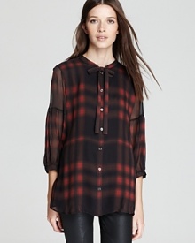 Plaids are softer this season, say goodbye to your lumberjack shirt and hello to this Burberry Brit blouse. Rendered in sheer silk, the feminine cut infuses your everyday style with romantic spirit.