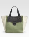 Sumptuous lambskin interpreted in bold colorblock, crafted in an oh-so-roomy carryall.Double top handles, 8 dropOne outside flap pocketOne inside zip pocketOne inside open pocketCanvas lining13W X 12H X 7DMade in Italy