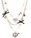 A study in contrast. Betsey Johnson's illusion necklace may have an airy, lightweight look, yet it's elaborately embellished with assorted charms. Anchored by a heart and arrow, it's surrounded by bows, hearts, cherry beads, glass pearls and glittering crystals. Made in antique gold tone mixed metal. Approximate length: 16 inches + 3-inch extender. Approximate drop: 4 inches.