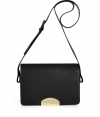 Streamline modern-minimalist looks with Maison Martin Margielas perfectly petite black leather flap-over shoulder bag - Metal plaque on flap, top zip, buckled shoulder strap, inside zippered back wall pocket - Team with deconstructed separates and edgy accessories