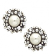 A pair of stud earrings from Bar III bursting with intrigue. Imitation pearls are surrounded by shimmering crystal accents. Crafted in gold tone mixed metal. Approximate diameter: 1 inch.