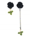 Flower power. Betsey Johnson's signature playful, quirky aesthetic has inspired these mismatched black rose earrings. Embellished with leaf accents, they're set in mixed metal. Approximate drop: 1 inch, 2-3/4 inches.