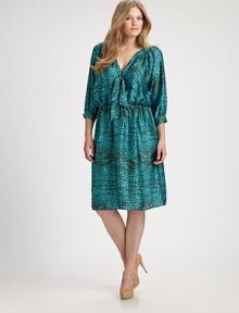 Perfectly printed, this satin design features an irresistible, tie-neck detail and a comfortable, elasticized waist. Pair this dress with nude-colored pumps.Self-tie detail at v-necklineThree-quarter sleevesButton detail on sleevesAllover printElasticized waistAbout 26 from natural waist60% silk/40% polyesterDry cleanMade in USA of imported fabric Perfectly printed, this satin design features an irresistible, tie-neck detail and a comfortable, elasticized waist. Pair this dress with nude-colored pumps.Self-tie detail at v-necklineThree-quarter sleevesButton detail on sleevesAllover printElasticized waistAbout 26 from natural waist60% silk/40% polyesterDry cleanMade in USA of imported fabric
