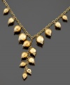 Glowing, gilded style. Spice up your daily look with this necklace crafted in brushed and polished 14k gold and sterling silver over sterling silver. Approximate length: 18 inches. Approximate drop: 3 inches.