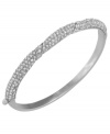 The perfect gift for your bridesmaids, Carolee's elegant style is perfect for walking down the aisle. Crafted from silver tone mixed metal, this hinged bangle features pave-set glass accents. Approximate diameter: 2-1/8 inches x 2-1/2 inches.