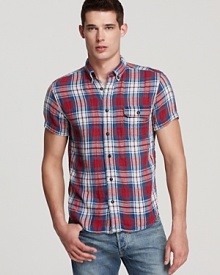 Brighten up your day with this classic plaid sport shirt that's festooned with color and rendered in soft cotton for an authentic look and feel. Brighten up your day with this classic plaid sport shirt that's festooned with color and rendered in soft cotton for an authentic look and feel.