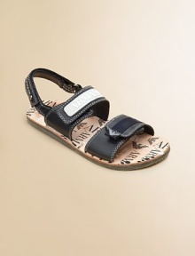 Luxe leather, grip-tape closure and signature detail lends a posh look to an everyday sandal. Grip-tape closureLeather upperLeather liningRubber soleImported