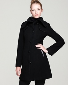 Woven leather-wrapped buttons and leather-trimmed shoulder detailing bring subtle gloss to this elegantly timeless Mackage pea coat. Woven leather-wrapped buttons and leather-trimmed shoulder detailing bring subtle gloss to this elegantly timeless Mackage pea coat.