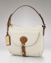 Classic style goes casual with this leather handbag from Lauren by Ralph Lauren. It's roomy interior easily holds the off-duty essentials, though it's timeless design works when it's time to clock in.