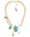 Let your accessories leap into spring. Betsey Johnson's antique gold tone mixed metal necklace features a gold-tone chain decorated by a blue glitter frog pendant with green and gold details and crystals accents with green and gold-tone leaves. Approximate length: 16 inches + 3-inch extender. Approximate drop: 3 inches.