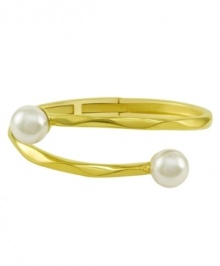 From the island of Mallorca, Spain, this beautiful hinged bangle bracelet features white organic man-made pearls (12 mm) set in 18k gold over sterling silver. Approximate diameter: 2-1/2 inches.