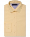 Make a solid statement. This slim-fit shirt from Tommy Hilfiger charges your look with a cool color rush.