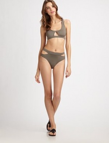 Cut. It. Out. A divine design that is beyond sexy, thanks to allover cutout details. Cutout detailsRacerback85% polyamide/15% elastaneHand washImported