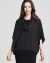 A draped cowl neckline flows into the carefree boxy silhouette of this Eileen Fisher wool sweater, finishing in an trend-right dipped hem.