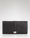 Elevate your essentials with Cole Haan's leather wallet, boasting spots for your coins, cards and cash. Take (bank) note: this accessory packs a color-pop.