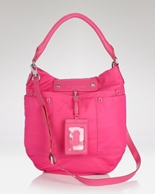 MARC BY MARC JACOBS' leather hobo take its cues from school-yard chic. The durable nylon bag touts essentials (or books,) making it a perfect partner for your day-to-day uniform. MARC BY MARC JACOBS' leather hobo take its cues from school-yard chic. The durable nylon bag touts essentials (or books,) making it a perfect partner for your day-to-day uniform.