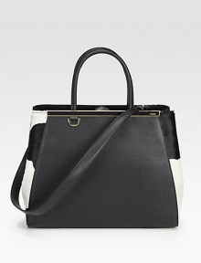 A streamlined silhouette of textured leather and luxe haircalf, features dual straps for carrying ease.Double top handles, 5½ dropRemovable shoulder strap, 13¼ dropSnap top closureProtective metal feetCenter zip compartmentTwo inside open pocketsFully lined14W X 10¾H X 6DMade in Italy