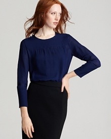 Flaunting ladylike luxury in a cerulean hue, this sheer MARC BY MARC JACOBS silk top boasts bold zip details at the shoulder and cuffs. Pair it with a pencil skirt for workday glamour.