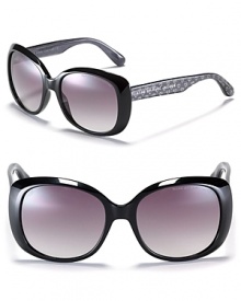 Oversized rounded cat eye sunglasses with metallic heart embellished arms from MARC BY MARC JACOBS. What's not to love?