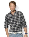 Drawing on inspiration from vintage flannels, a classic workshirt exudes rugged style in a bold plaid pattern.