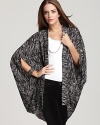 Layer this beautifully billowy Volcom cape over jeans and a tee for a modern edge.