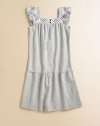 A simple piqué frock is given a stylish update with flutter sleeves and classic check trim.SquareneckFlutter sleevesFront buttonsDrop-waistRounded hem95% cotton/5% elastaneMachine washImported Please note: number of buttons may vary depending on size ordered. 