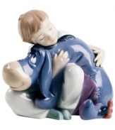 A sweet boy brings a smile even to Eeyore's face in this heartwarming figurine for Winnie the Pooh fans and Lladro collectors.