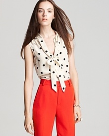 Playful and feminine in a eye-catching polka dot print, this silk MARC BY MARC JACOBS top boasts a charming neck tie and decorative buttons for work-to-weekend chic.