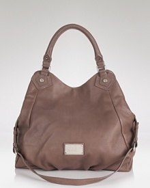 Practical style gets a hit of cool with this leather tote from MARC BY MARC JACOBS. On-trend and oversized, this luxe bag is a must for the on-the-go it-girl. Practical style gets a hit of cool with this leather tote from MARC BY MARC JACOBS. On-trend and oversized, this luxe bag is a must for the on-the-go it-girl.